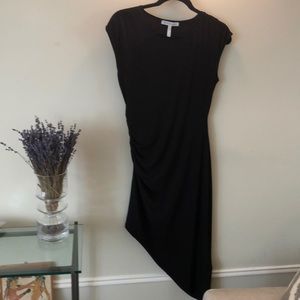 Black fitted dress.  Asymmetrical.